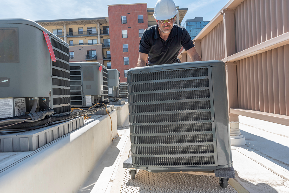Technician handling AC replacement in Las Vegas
